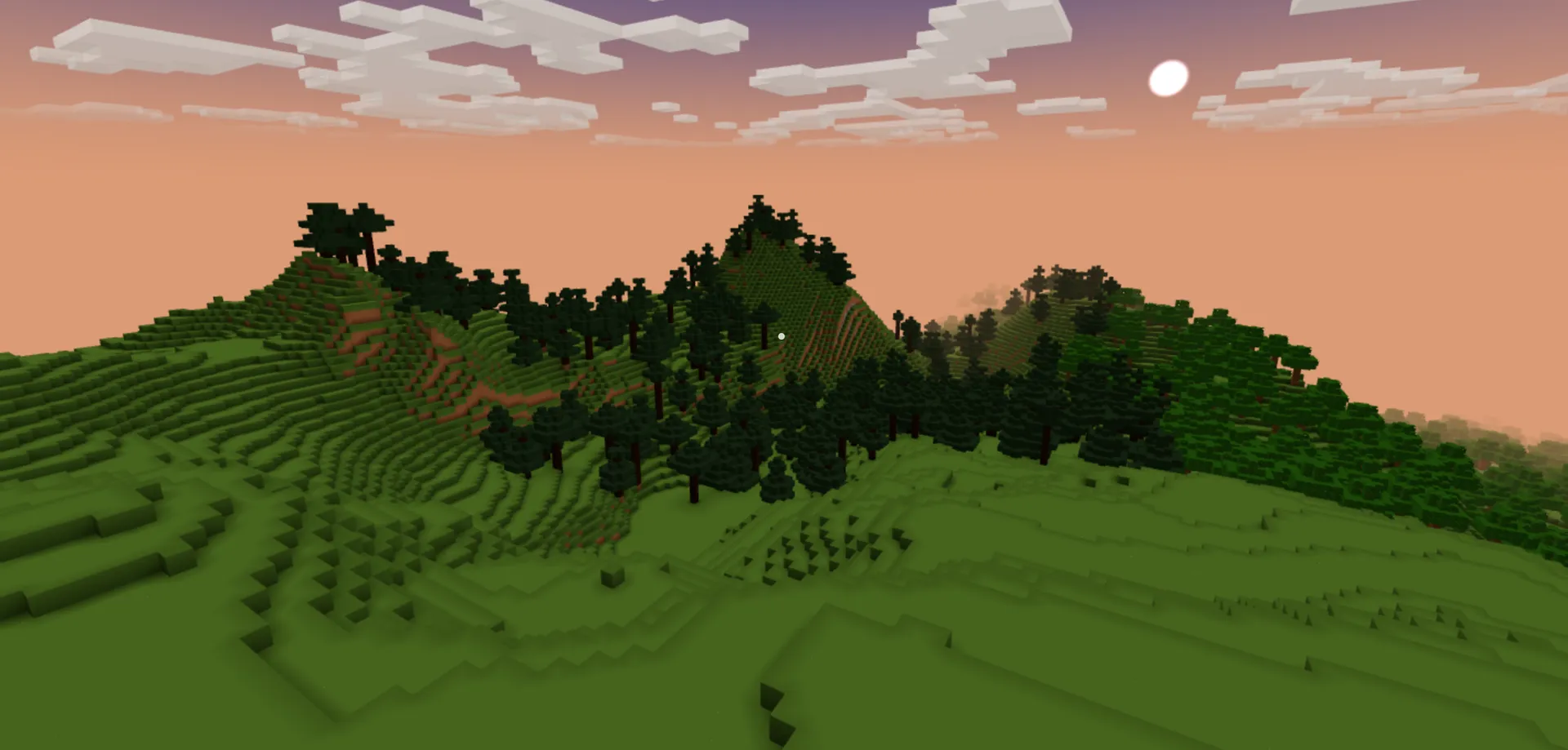 Forested blocky mountains under a dusk sky, with the moon out above layered clouds.