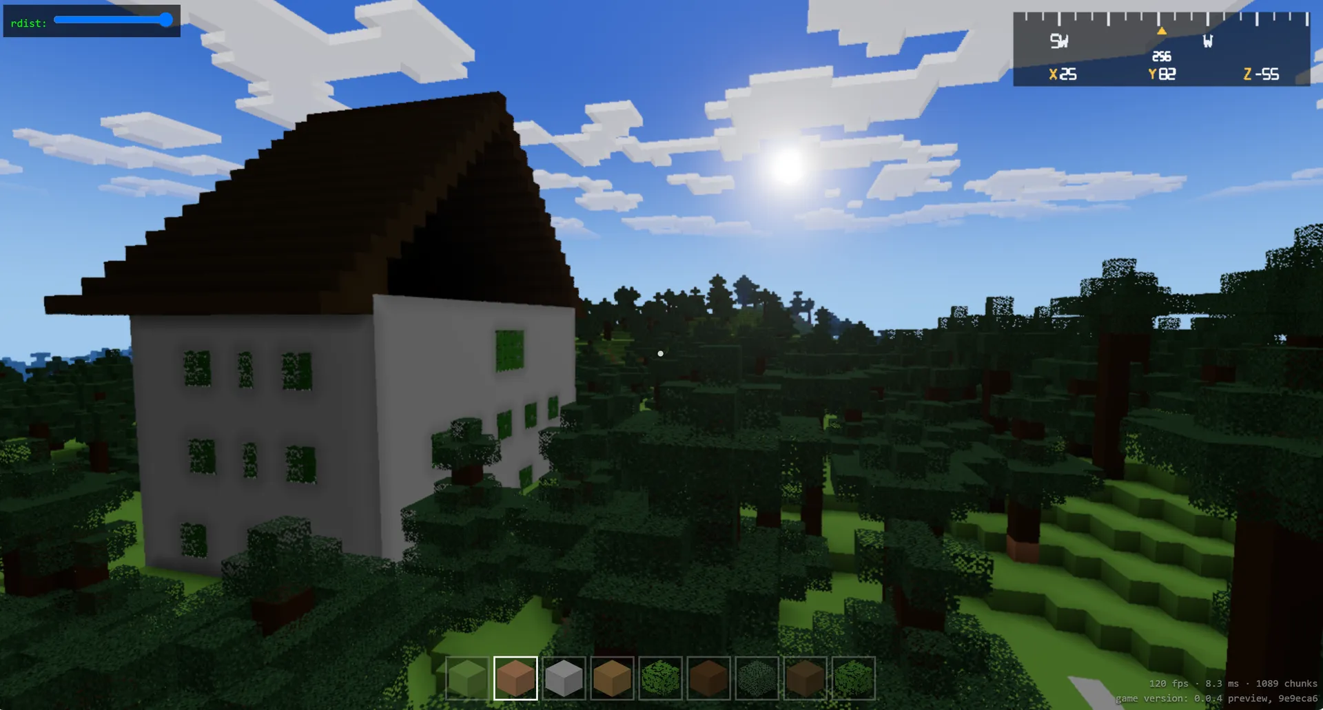 A player-built white house with a dark pitched roof standing in dense blocky forest under a blue midday sky, with the in-game HUD and hotbar visible.